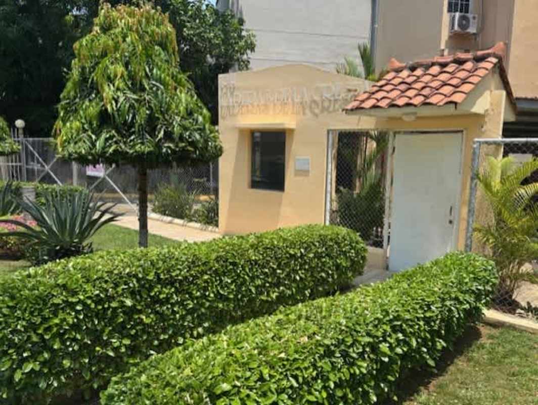 Gated building entrance with landscaping PH La Cresta Panama