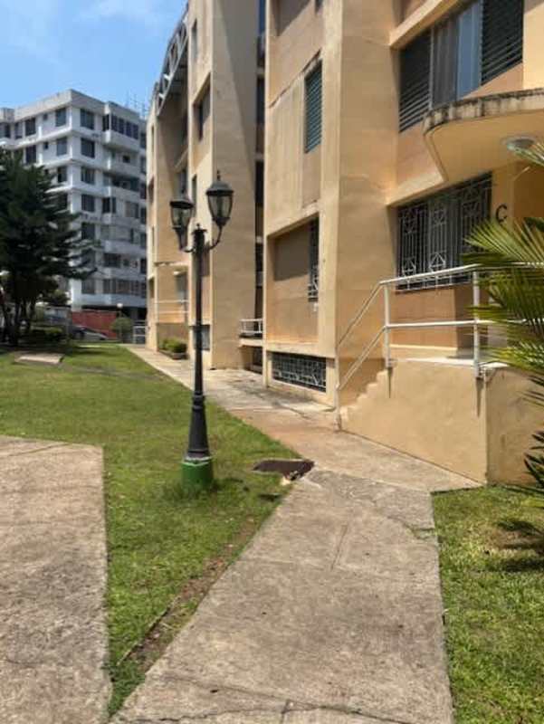 Exterior of PH La Cresta with walkway, garden, and multiple floors Central Panama City