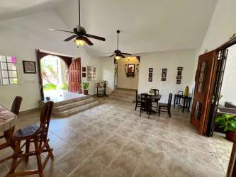 Open plan living dining with vaulted ceiling at Punta Barco house for sale