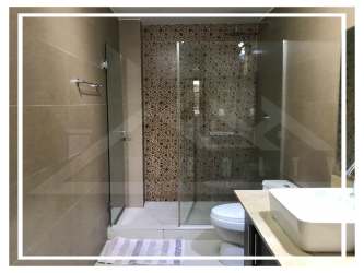 Bathroom with glass-enclosed shower, mosaic tile, modern vanity PH Mosaic Panama Pacifico