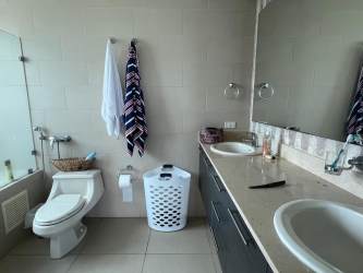 Equipped kitchen with granite countertops and appliances in Bijao Beach Club Panama