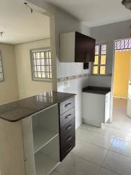 Empty interior room tile floor barred window white walls Green Village Nuevo Arraiján Panama