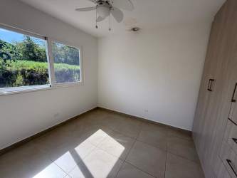 Empty bedroom with wardrobe large window tiled floor Costa Verde New West Panama