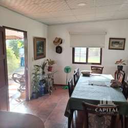 Entrance hall or living space with stone wall, tiled floors at Santa Ana country home Los Santos Panama
