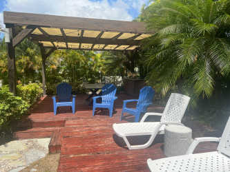 Modern open living space with granite kitchen island, dining and lounge area in Bijao Panama