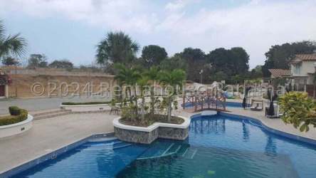 Large swimming pool with islands, palm trees and lounge area Playa Dorada Panama