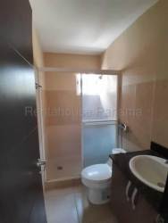 Covered backyard patio with tiled floors overlooking private fenced yard in Playa Dorada San Carlos Panama