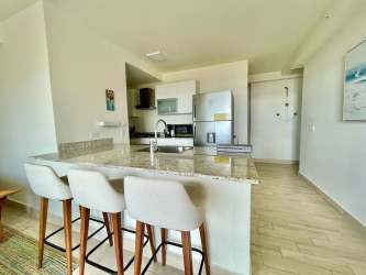 Guest room with twin beds ceiling fan and window at Playa Caracol Punta Chame