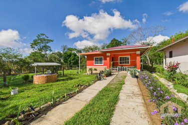 Living room with large windows, wood floors and eclectic decor Potrerillos Abajo Dolega Panama