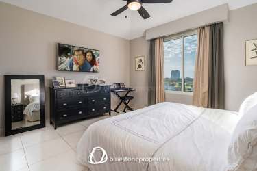 Modern open kitchen with granite counters connected to dining space with lake views in Buenaventura