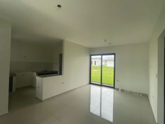 Front covered terrace and garden area at Residencial Bariloche affordable house for rent in Dolega Chiriquí