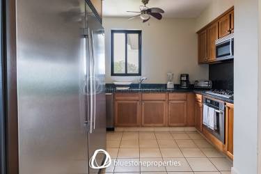 Open concept living and dining area with large windows overlooking golf Buenaventura Panama