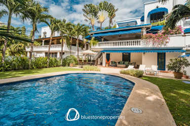 Mediterranean villa exterior with private pool, tropical landscaping and balconies Playa Blanca Panama