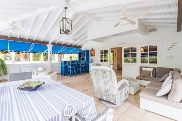 Covered lounge patio with vaulted ceiling, dining, sofa bar area Playa Blanca luxury villa
