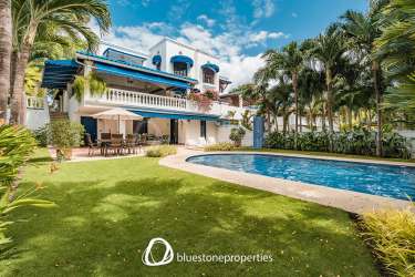 Bright traditional bathroom with double sink, large mirror, tile walls in Playa Blanca beachfront villa