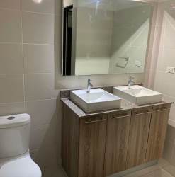 Contemporary tile bathroom with shower stall in Panama Pacifico apartment