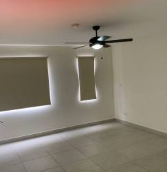 Living room with ceiling fan and ceramic floors in Woodlands mid-rise Panama Pacifico