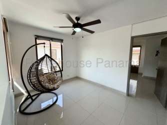 Large bright living room with AC unit and tile floors in Senderos de Bambú community Arraiján Panama