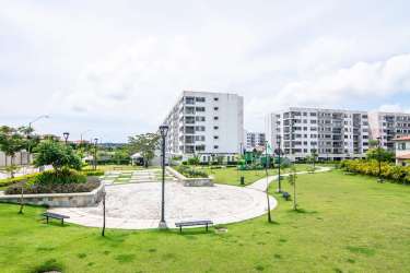 Semi-open kitchen with tile backsplash laminate counters in PH Midrise Panama Pacifico