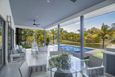 Open living dining with floor-to-ceiling windows modern beach home Buenaventura Panama