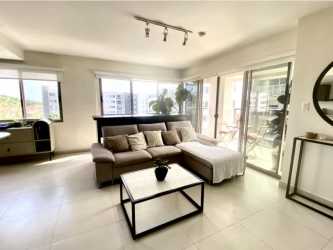 Spacious modern living room with balcony access, tile floors at PH Midrise Woodlands Panama Pacifico