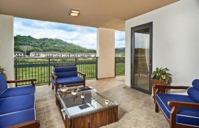 Large terrace with outdoor seating overlooking greenery and river in PH River Valley Panama Pacifico