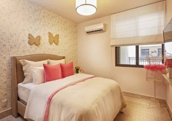 Modern kids bedroom with bunk beds, window view at PH River Valley Panama Pacifico