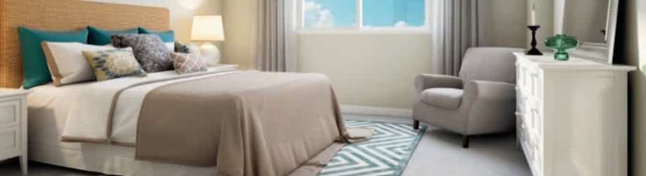 Master bedroom with large window, scenic views and neutral decor Bijao Beach Club Panama