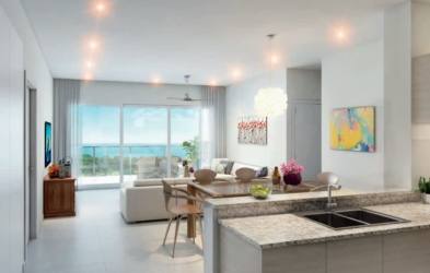 Modern bedroom with two beds, large window and ocean view balcony in Bijao Beach Club condo Rio Hato Panama