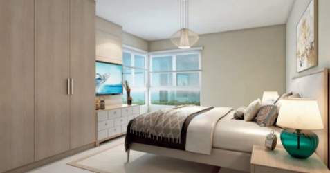 Large outdoor pool area at Bijao Beach Club with sun beds, cabanas and gardens in Rio Hato Panama