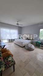 Large window bedroom with garden views and elegant finishes in luxury villa Ocean Lakes Panama