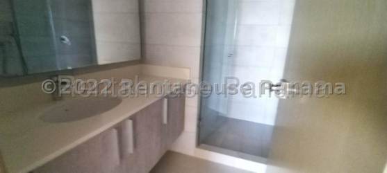 Apartment balcony with outdoor seating, garden and pool view in Panama Pacifico