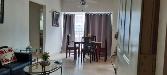 Living room with sofa dining set balcony doors furnished Playa Dorada Panama