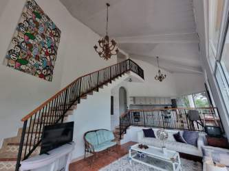 Bedroom featuring direct balcony access with stunning mountain views in Altos del María Panama