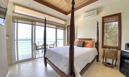 Bedroom with large windows oceanview balcony access Casa Caracol Playa Corona Panama