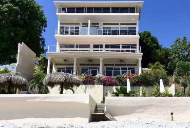 Four-story beachfront villa balconies beach access Casa Caracol Playa Corona Panama