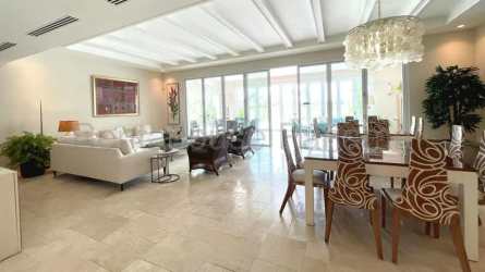 Open-concept living area with high ceilings and lake views in luxury villa Buenaventura Panama