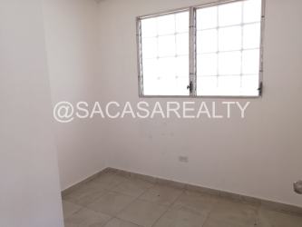 Open dining area with glass table minimalist decor rental house Arraiján Panama