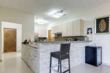 Ground floor terrace with lush private garden in Bijao Beach Club Panama condo