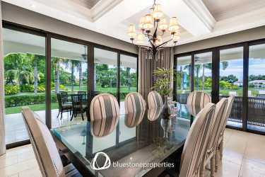 Furnished primary bedroom with lake view and ensuite bath at Buenaventura Panama