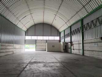 Exterior industrial warehouse with parking and multiple roll-up doors La Chorrera Panama