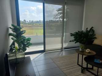 Open concept living-dining area in brand new apartment with tile floors and balcony Costa Verde