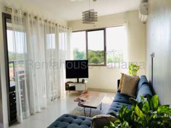Spacious living room with natural light and access to balcony in Woodlands Panama Pacifico