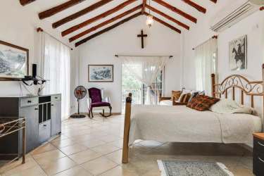Rustic Mediterranean bedroom with exposed beams, balcony, AC and garden views Punta Barco