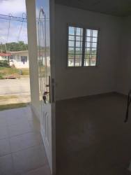 Entryway with open door, tiled floors, secure window bars in Mendoza Valley affordable rental Panama