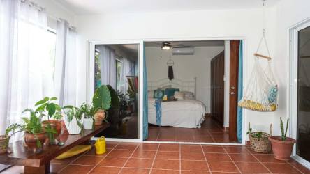 Private swimming pool surrounded by lush gardens at Santa Clara villa beach home Panama