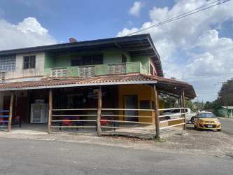 Exterior view of corner commercial and residential building Barrio Balboa La Chorrera