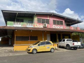 Two-story mixed-use commercial and residential building front view in Barrio Balboa Panama