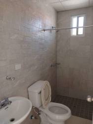 Clean tiled bathroom with shower sink toilet in Ventanas al Mar La Chorrera Panama