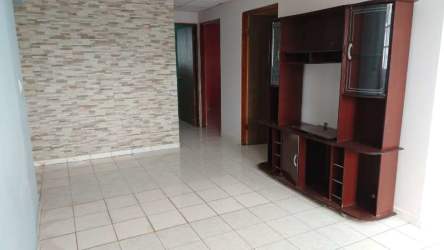 Living room space with tiled floor and stone accent wall in Villas de La Alameda Arraiján Panama